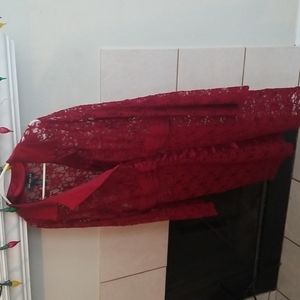 Mid-length semi sheer duster with a collar .